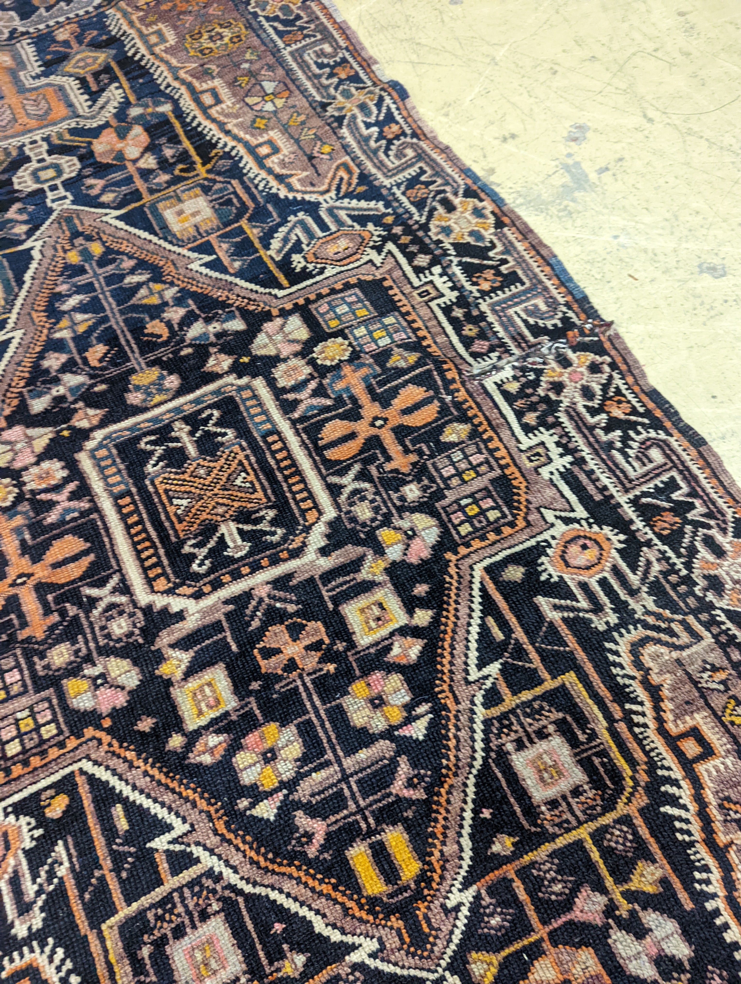 A Caucasian design blue ground rug, 224 x 111cm